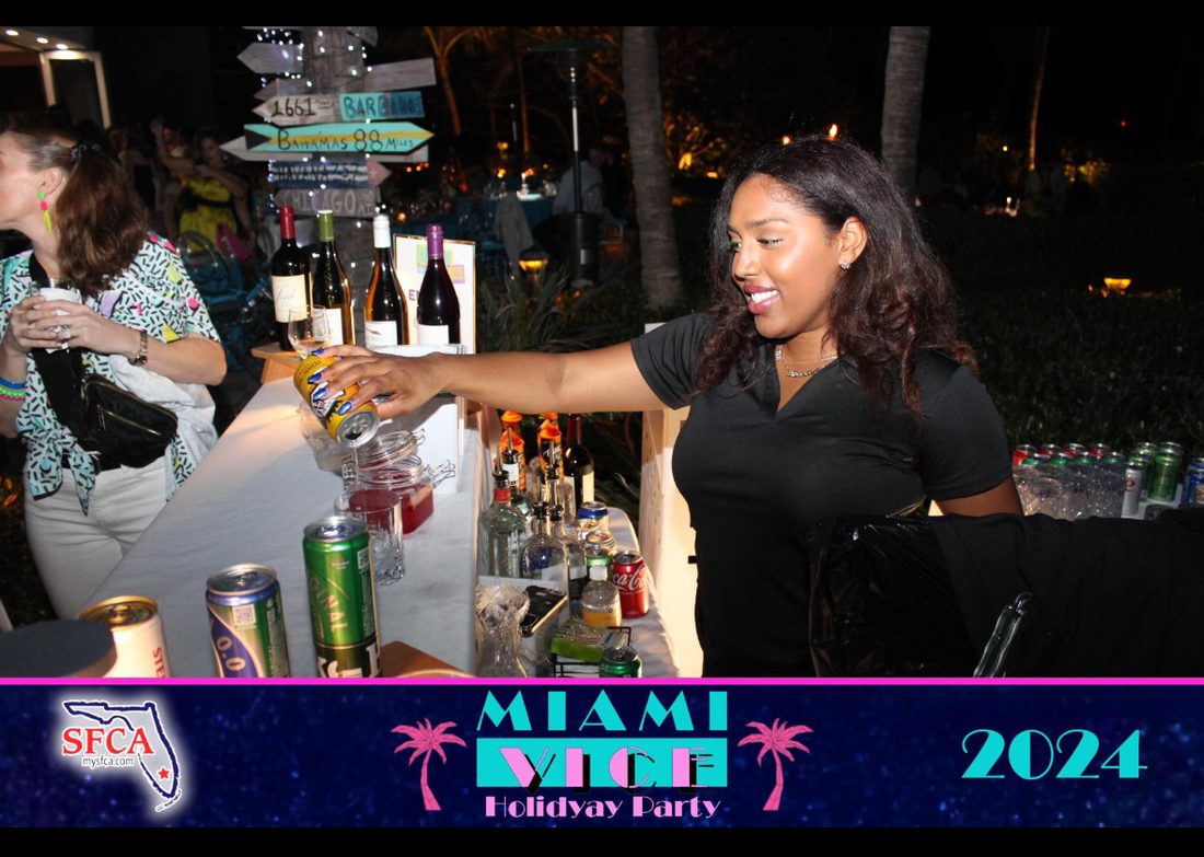 Rosie serving at the South Florida Claims Association Miami Vice holiday party, 2024
